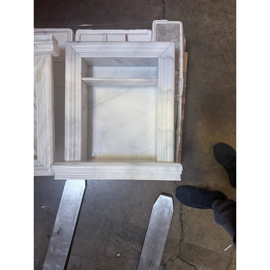 White marble fireplace mantel displayed in the Hand Made Marble Shampoo Niche product image