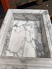 White marble fireplace surround with grey veining for Hand Made Marble Shampoo Niche