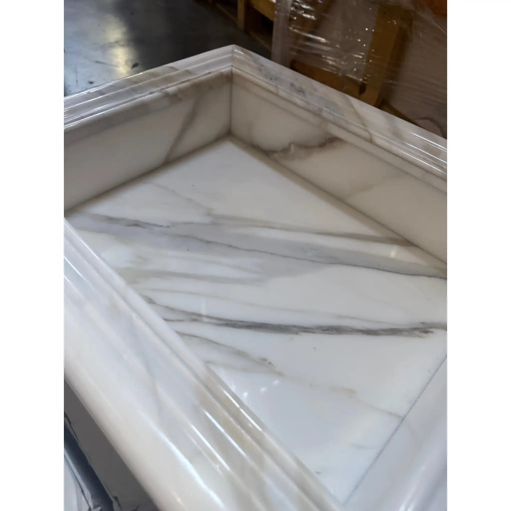 White marble fireplace mantel from the Hand Made Marble Shampoo Niche collection