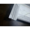 Handmade white marble shampoo niche with ornate fireplace mantel profile