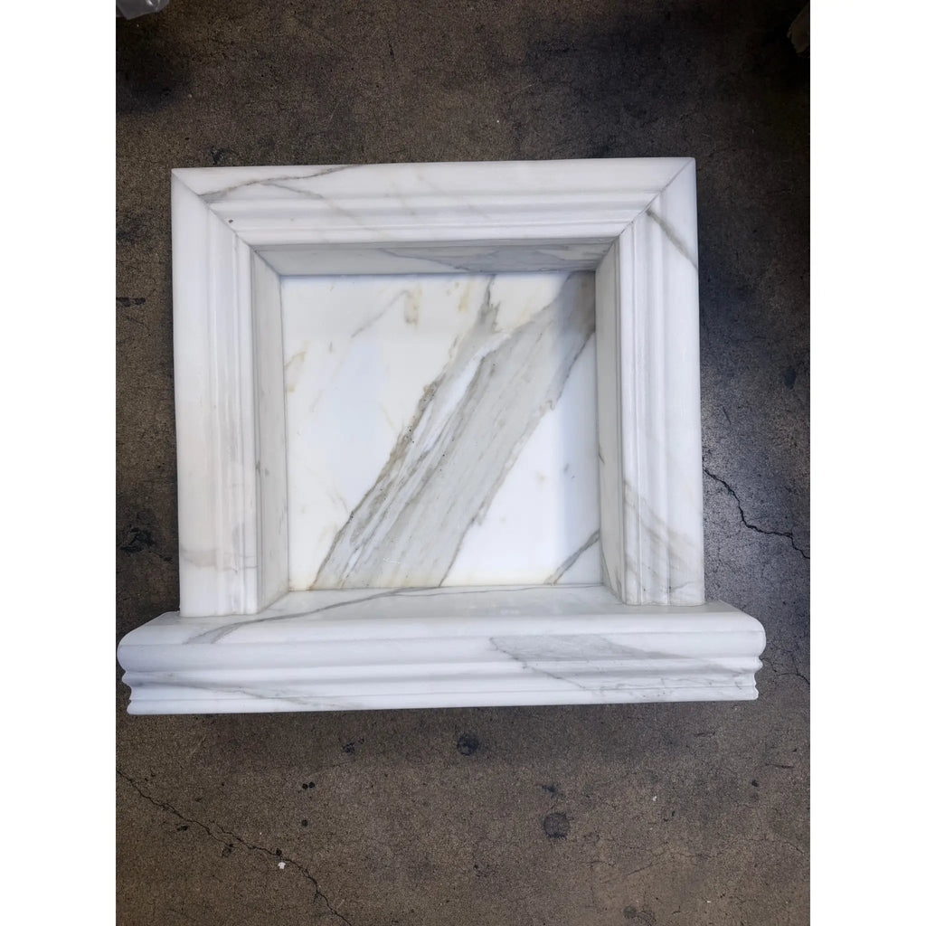 Handmade white marble shampoo niche with elegant carved molding