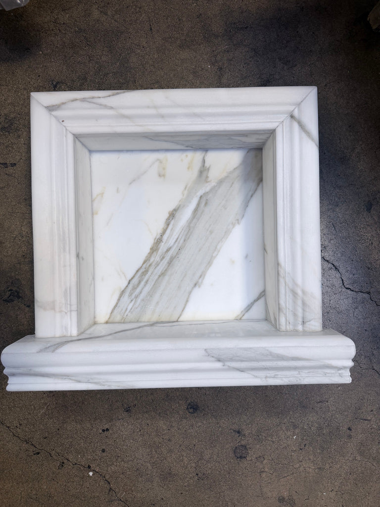 Handmade white marble shampoo niche with elegant carved molding