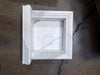 Handmade white marble shampoo niche with elegant classical molding