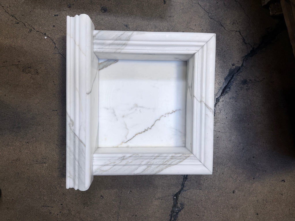 Handmade white marble shampoo niche with elegant classical molding