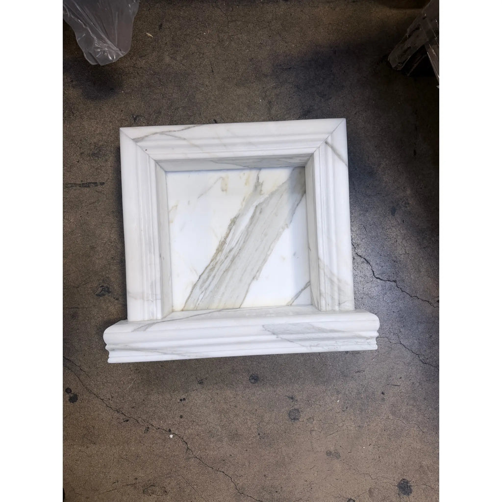 Elegant white marble shampoo niche with classic frame and gray veining