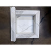Handmade marble shampoo niche in white frame with fluted edges and gray veining