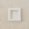 White recessed wall niche in the Hand Made Marble Shampoo Niche for stylish storage