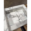 White marble sink with grey veining in handcrafted Marble Shampoo Niche