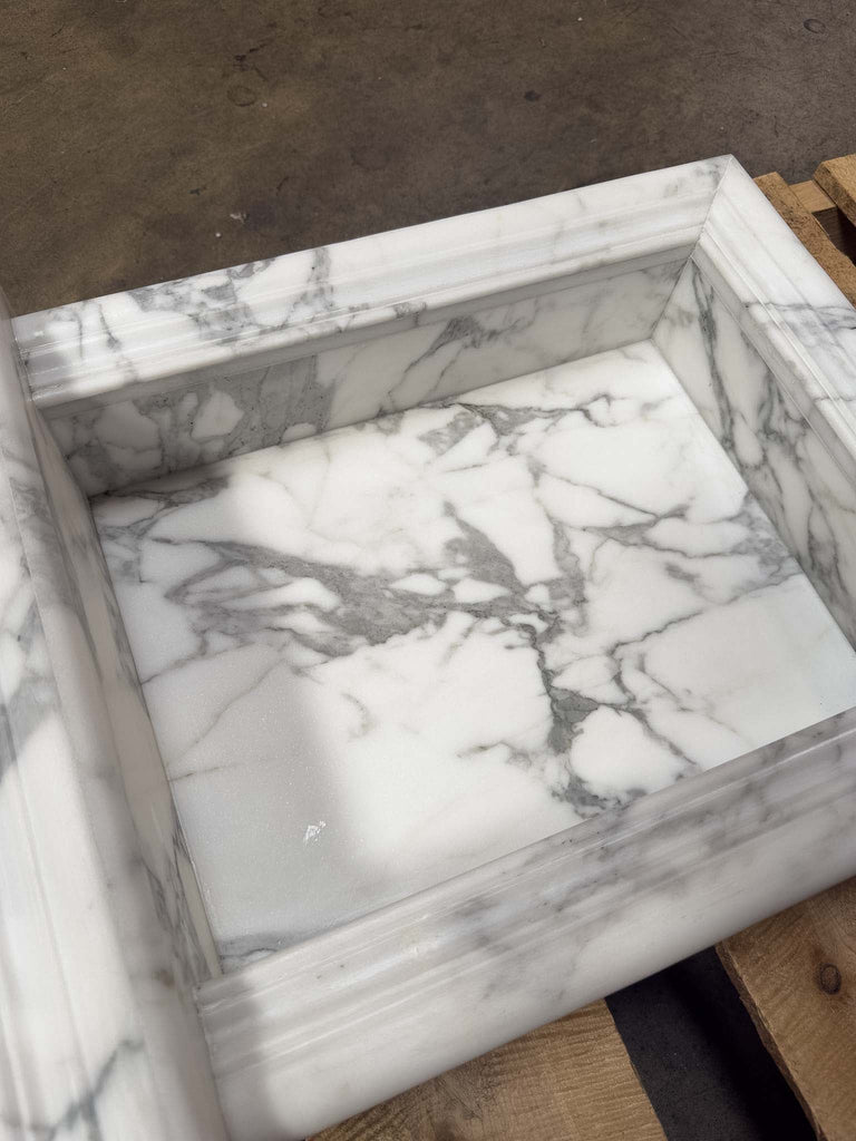 White marble sink with grey veining in handcrafted Marble Shampoo Niche