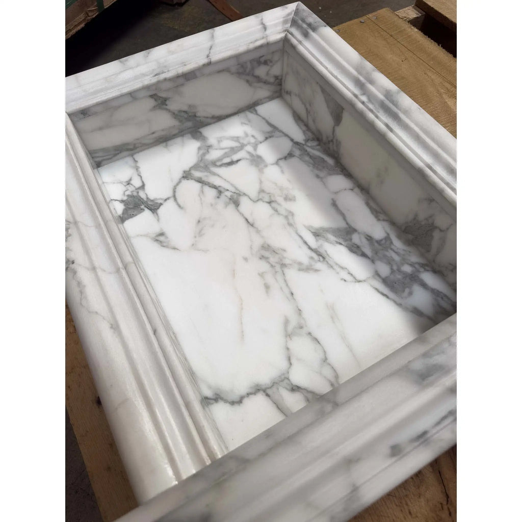 White marble sink basin with gray veining and decorative carved edges for Hand Made Marble Shampoo Niche
