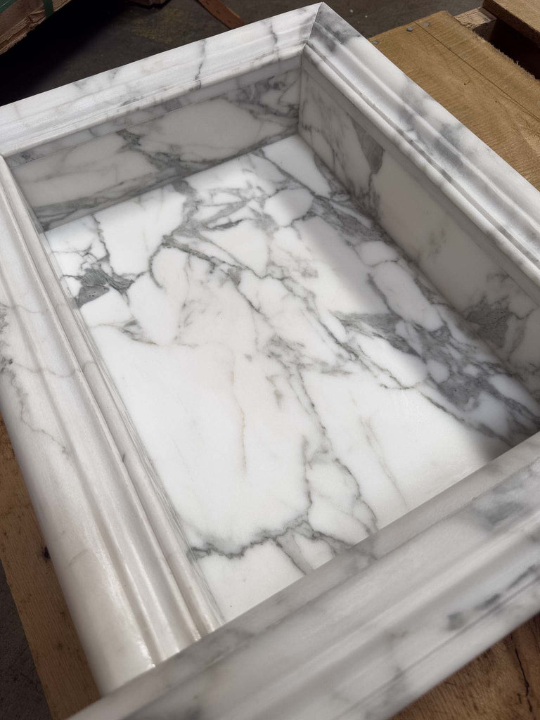 White marble sink basin with gray veining and decorative carved edges for Hand Made Marble Shampoo Niche