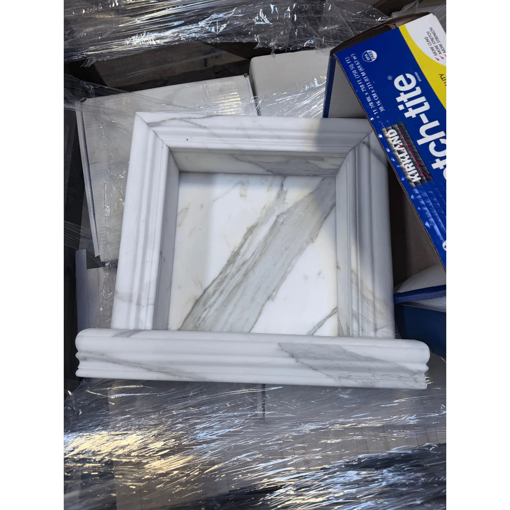 Handmade white marble shampoo niche in elegant square frame with gray veining