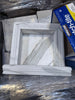 Handmade white marble shampoo niche in elegant square frame with gray veining