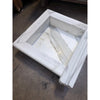 Handmade marble shampoo niche with white square basin, fluted edges, gray veining