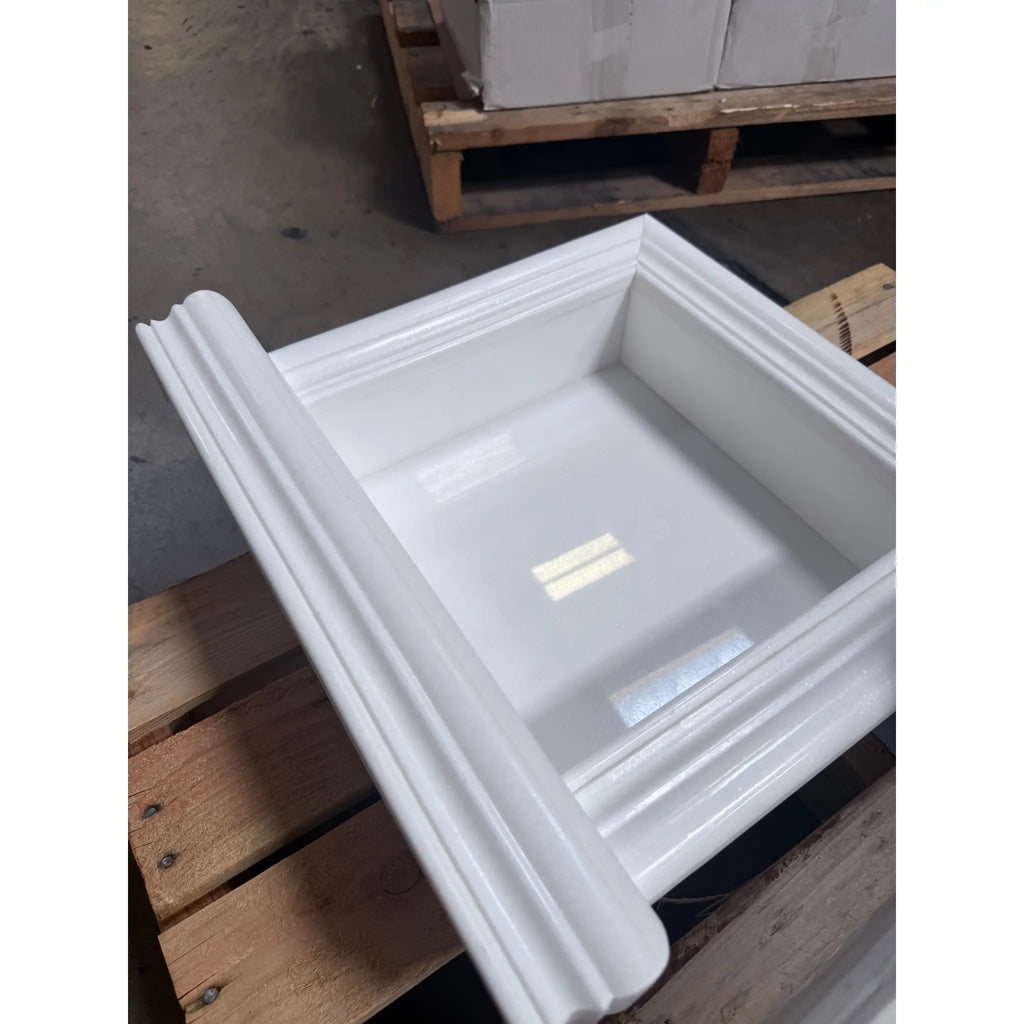 White square-shaped deep marble shampoo niche with decorative molded edges