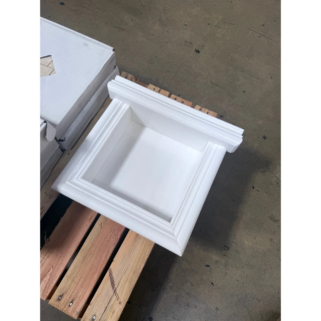 White square recessed marble shower niche with decorative molding for elegant bathroom storage