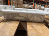 White marble trough sink with gray veining in the Hand Made Marble Shampoo Niche