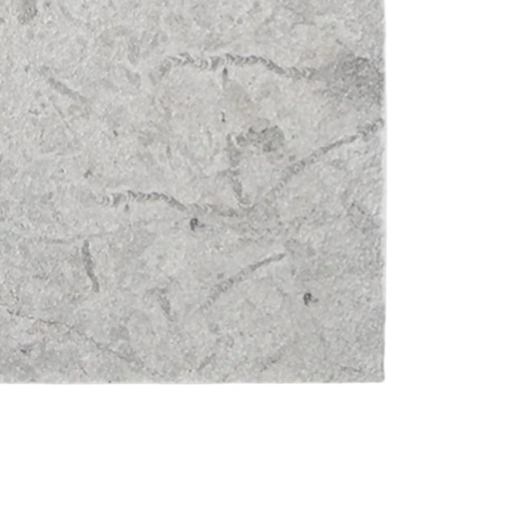 Imperio Grey 12x24 honed limestone tile with textured gray stone surface and subtle veining