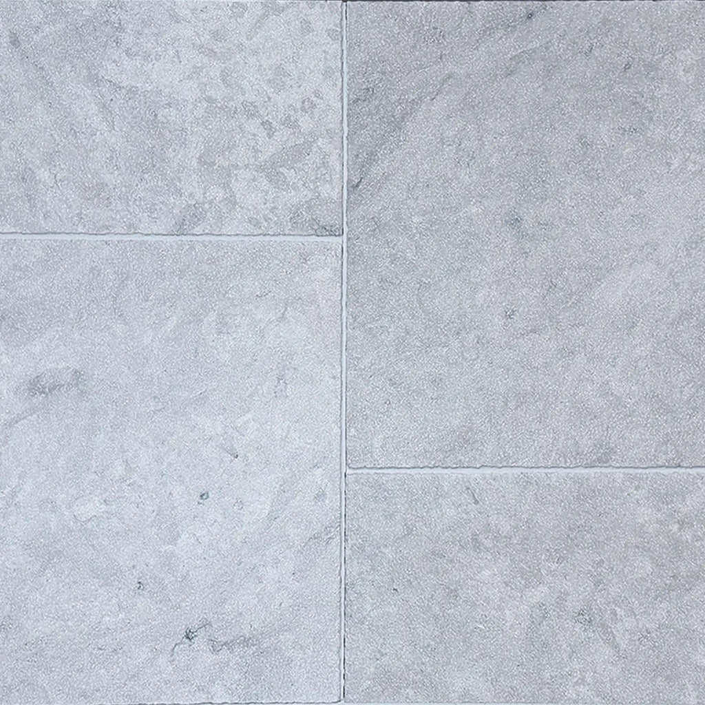 Imperio Grey 12x24 honed limestone tiles with gray stone texture and faint veining