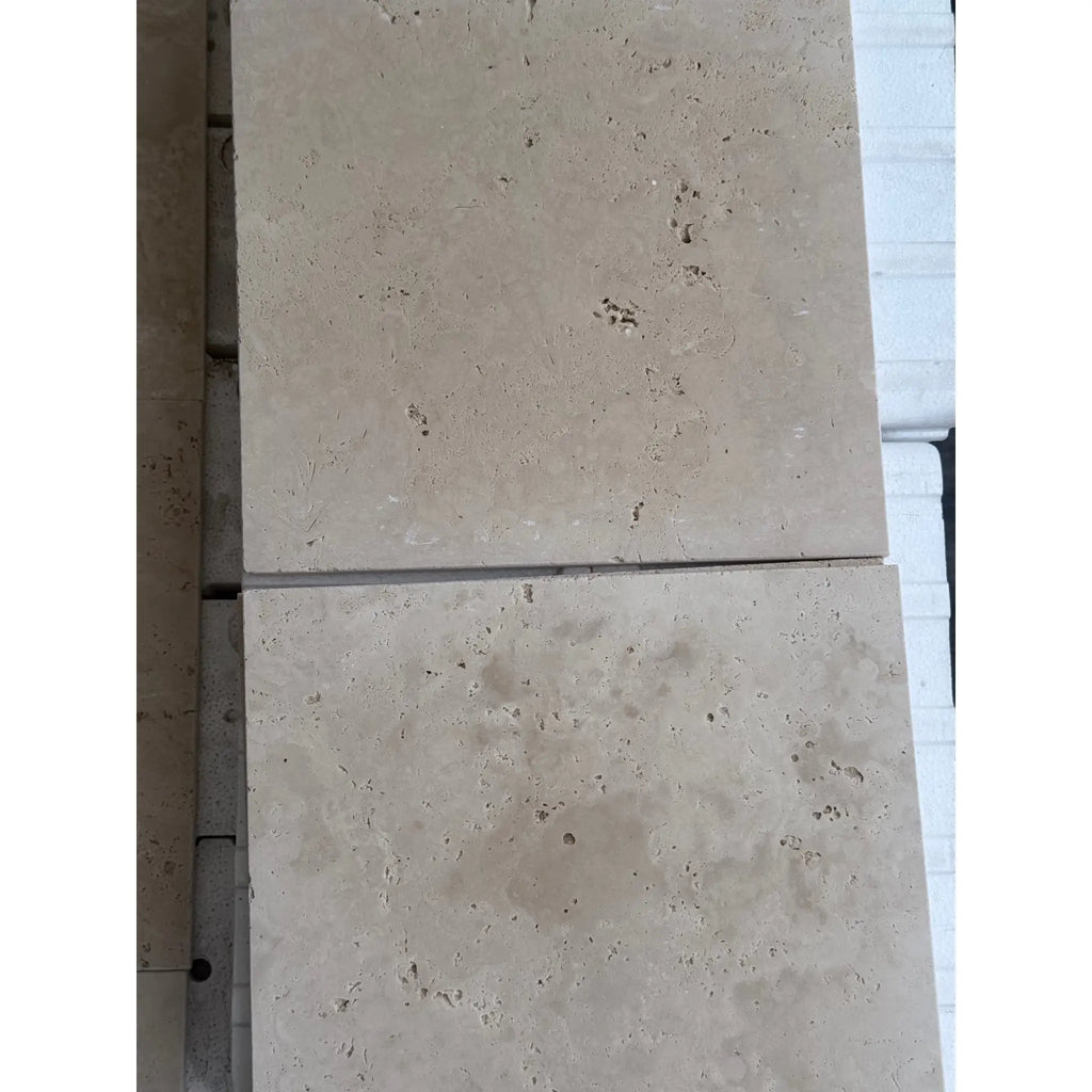 Beige travertine tiles of Ivory Light Travertine 12X12 Cross-Cut Tumbled product