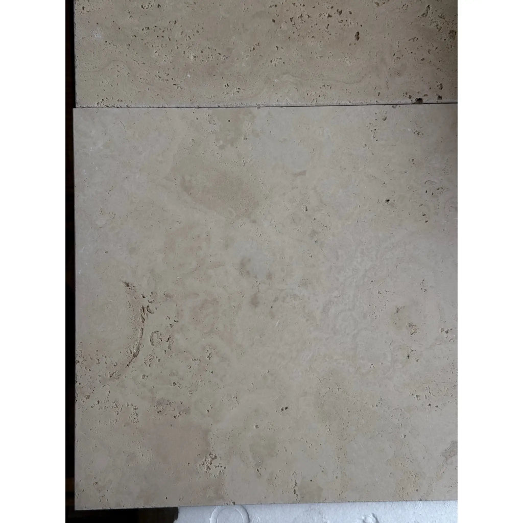 Beige travertine tiles in Ivory Light Travertine 12X12 Cross-Cut Tumbled finish