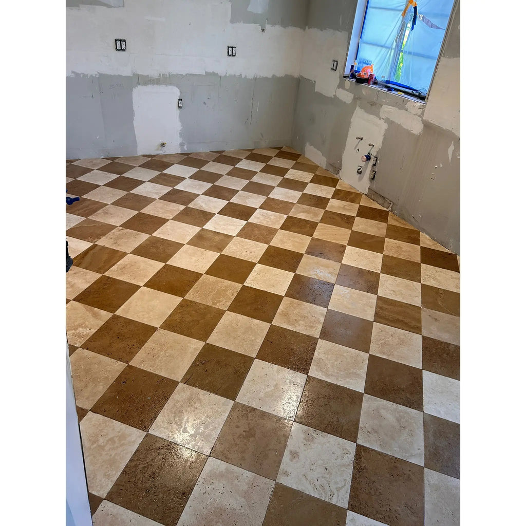 Checkerboard tile floor featuring Ivory Light Travertine 12x12 Tumbled Cross-Cut design