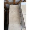 Stacked Ivory Light Travertine 12X12 Cross-Cut Tumbled tiles showcasing elegance