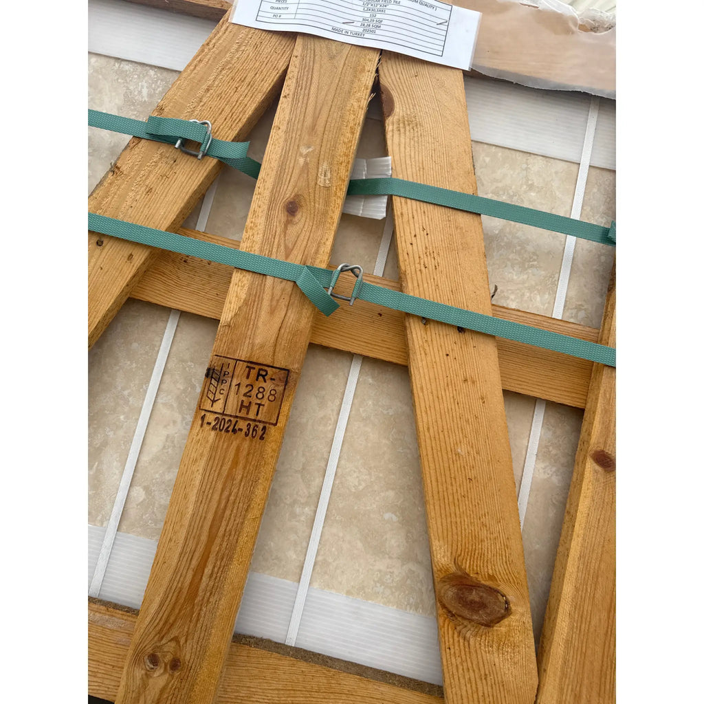 Wooden shipping crate with green straps for Ivory Light Travertine 12x24 Cross-Cut tiles