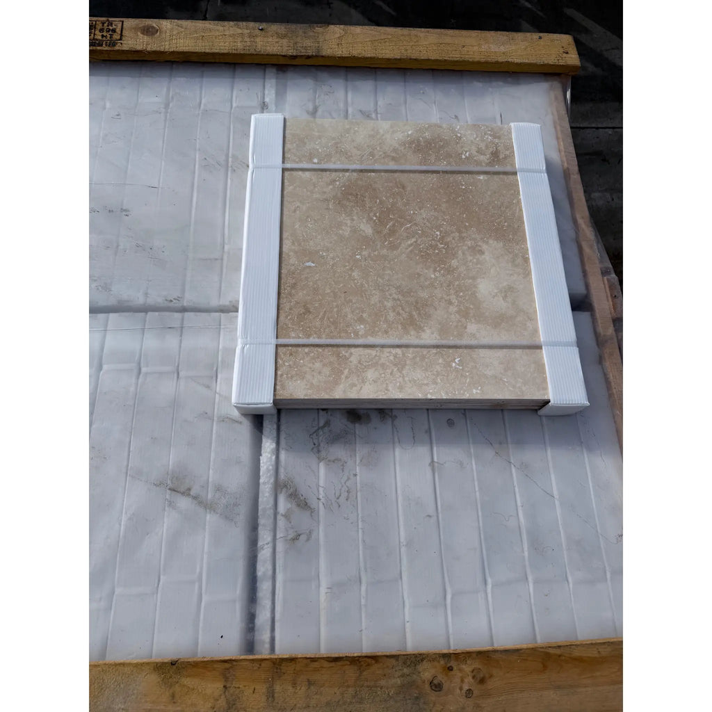 Ivory light travertine 18x18 cross-cut tile, beige marble with veining in white frame