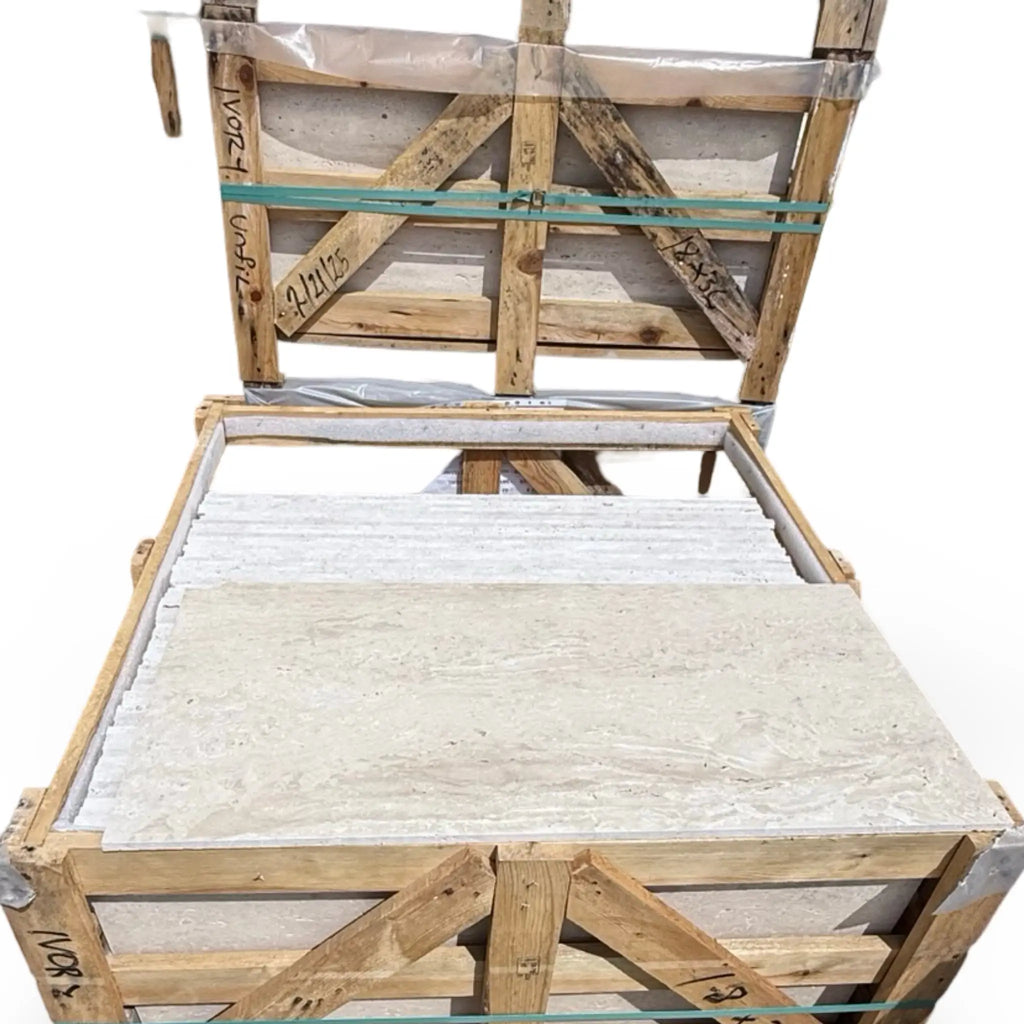 Wooden crate filled with Ivory Light Travertine 18X36 vein-cut stone tiles