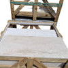 Wooden crates containing Ivory Light Travertine 18X36 vein-cut stone slabs