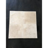 Four beige Ivory Travertine 1X1 Mosaic Filled and Honed tiles displayed together