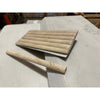 Beige travertine pencil liner and fluted border tiles for elegant bathroom or kitchen design
