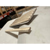 Light-colored textured travertine 1x6 quarter-round trim tile with rounded edge and speckled surface