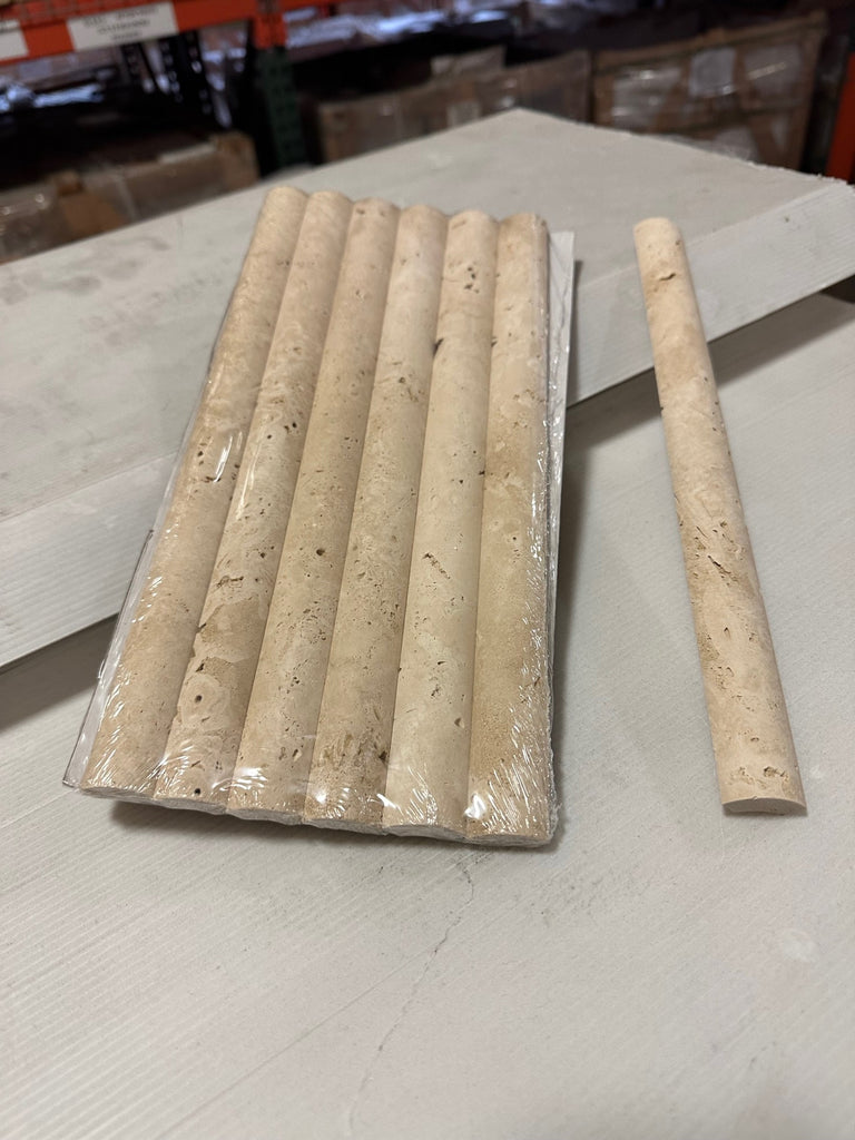 Bundle of eight Ivory Light Travertine 1X6 Quarter-Round Tiles with one tile beside