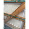 Green straps with metal buckles secure Ivory Travertine 24x24 crate