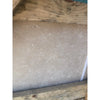 Textured off-white wall with wooden framing featuring Ivory Light Travertine 24x24 tiles