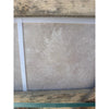 Light gray textured tile from Ivory Travertine 24x24 Cross-Cut Filled and Honed product