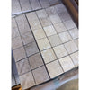 Ivory light travertine 2x2 mosaic tiles in beige and cream with natural stone texture wrapped in clear plastic
