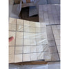 Ivory light travertine 2x2 mosaic beige square tiles with subtle marbled texture wrapped in clear plastic