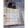 Ivory light travertine 2x2 mosaic filled honed beige tile panel with subtle marbled texture and thin gray grout lines