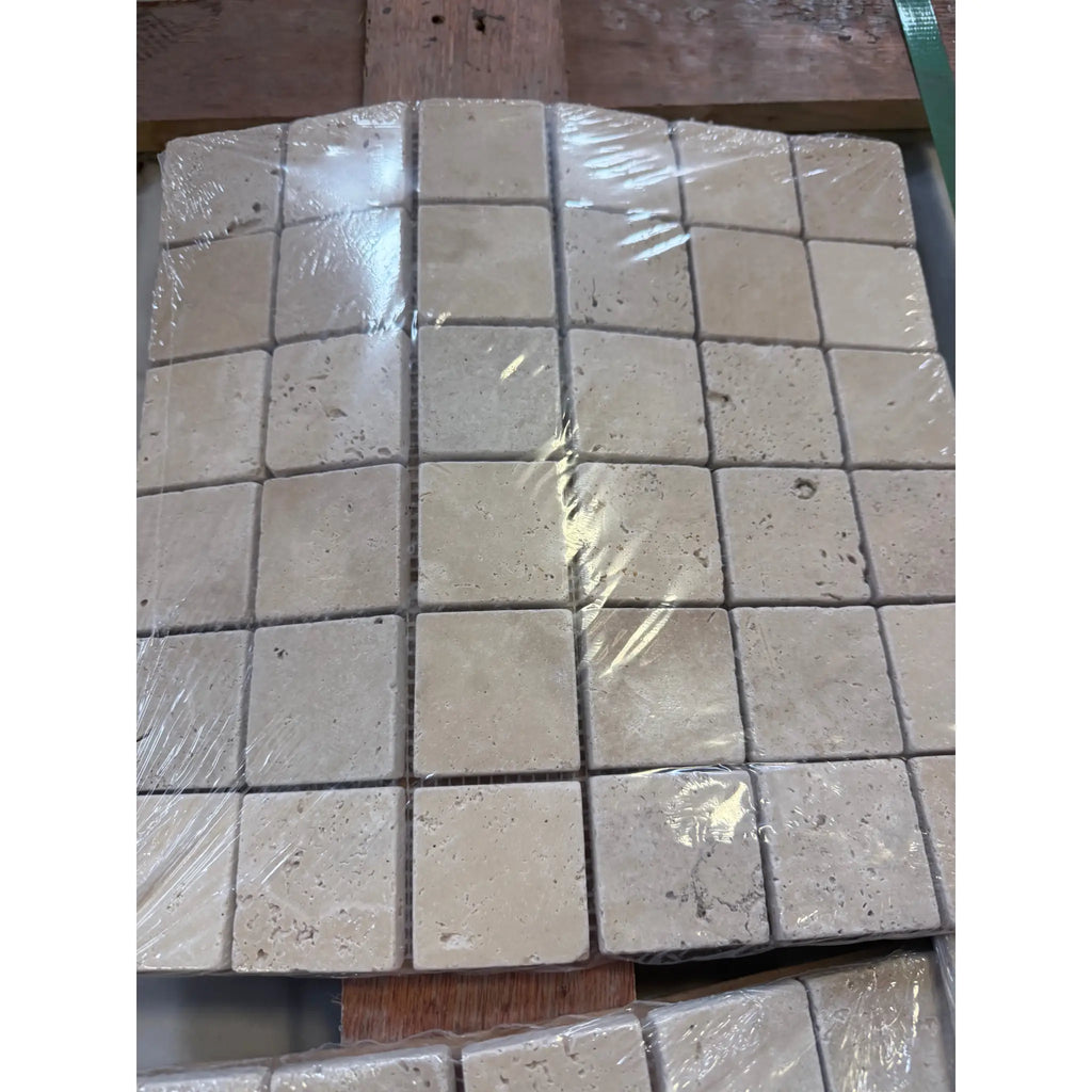 Ivory light travertine 2x2 mosaic tumbled beige stone tiles wrapped in clear plastic for wall and floor applications