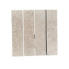 Four Ivory Light Travertine 3’’ X 12’’ Field Tiles displayed together