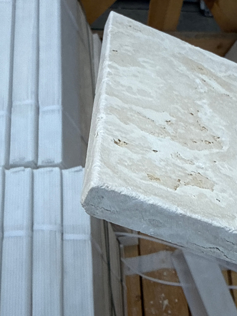 Textured off-white stone tile from Ivory Light Travertine Versailles Pattern Set