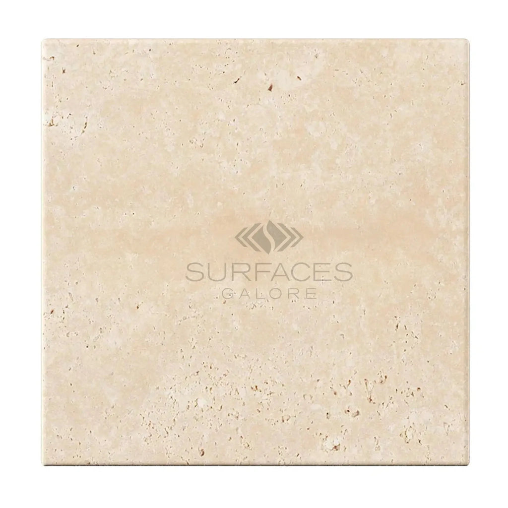 Beige travertine tile displayed in Ivory Light Travertine 4X4 Cross-Cut Tumbled design