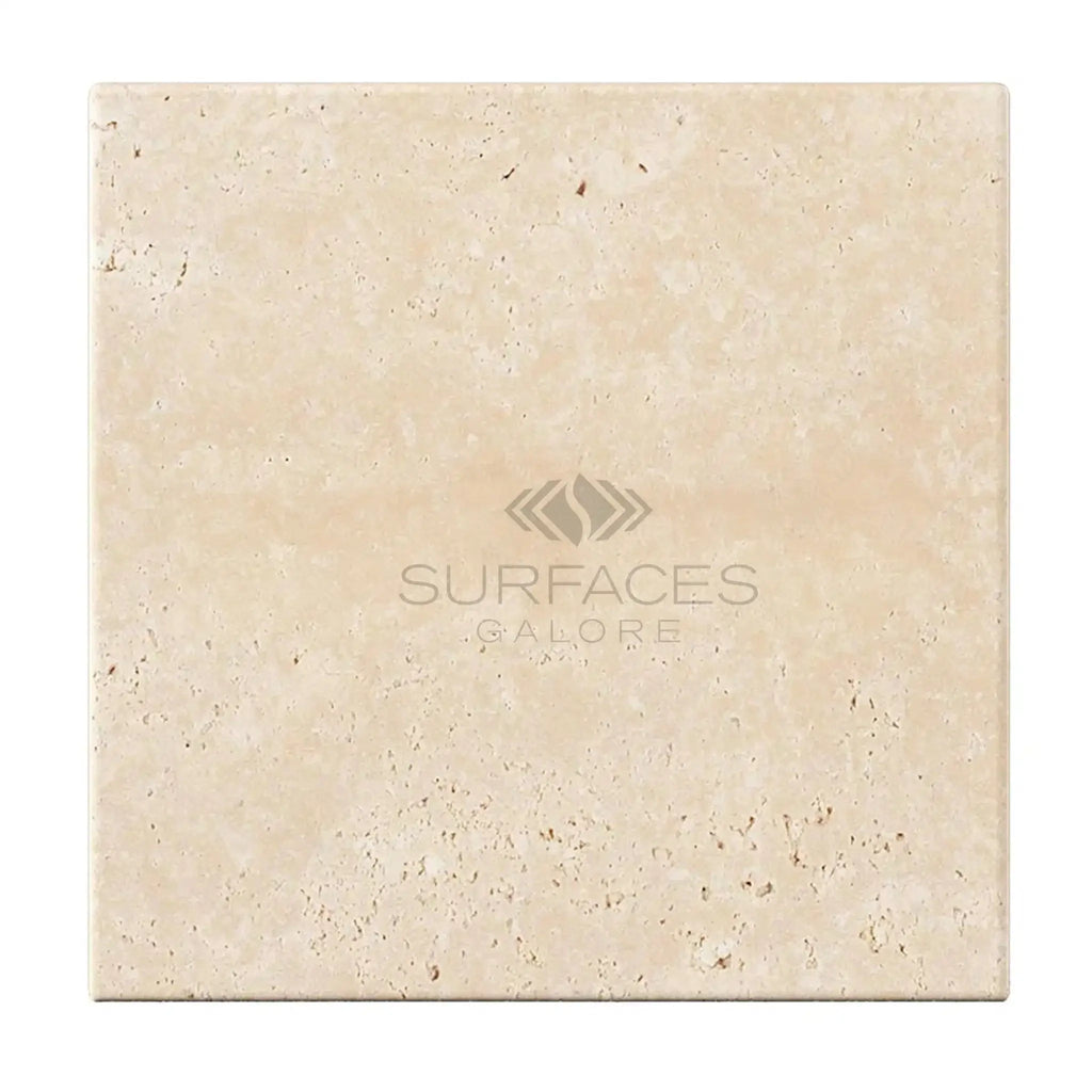 Beige travertine tile displayed in Ivory Light Travertine 4X4 Cross-Cut Tumbled design