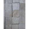 Square ivory travertine tiles in 4x4 cross-cut tumbled finish for elegant flooring