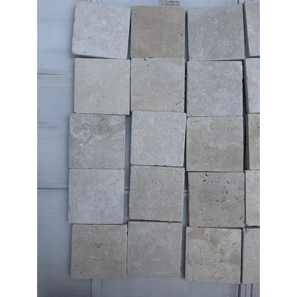 Square travertine tiles in Ivory Light a Tumbled Cross-Cut finish for flooring or walls