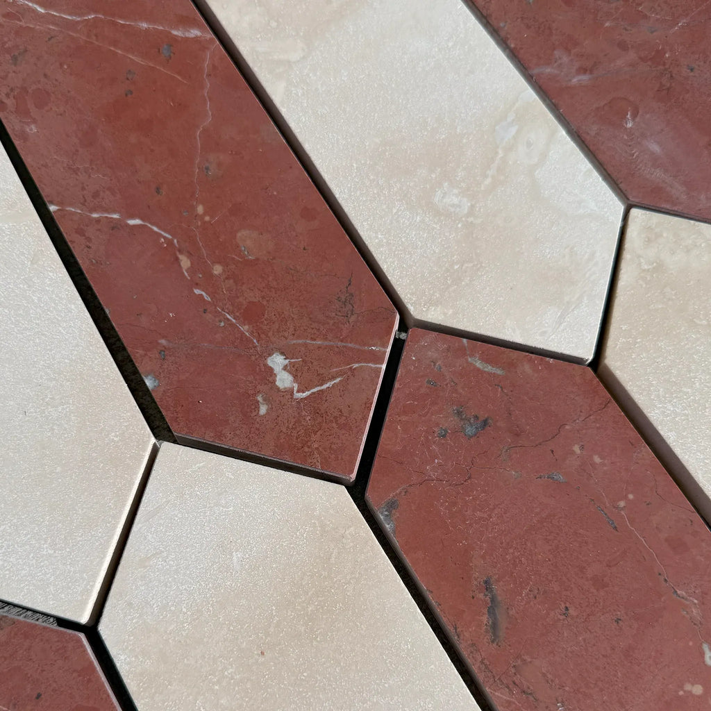 Alternating red and beige marble tiles in Ivory Travertine & Nero Marquina Mosaic