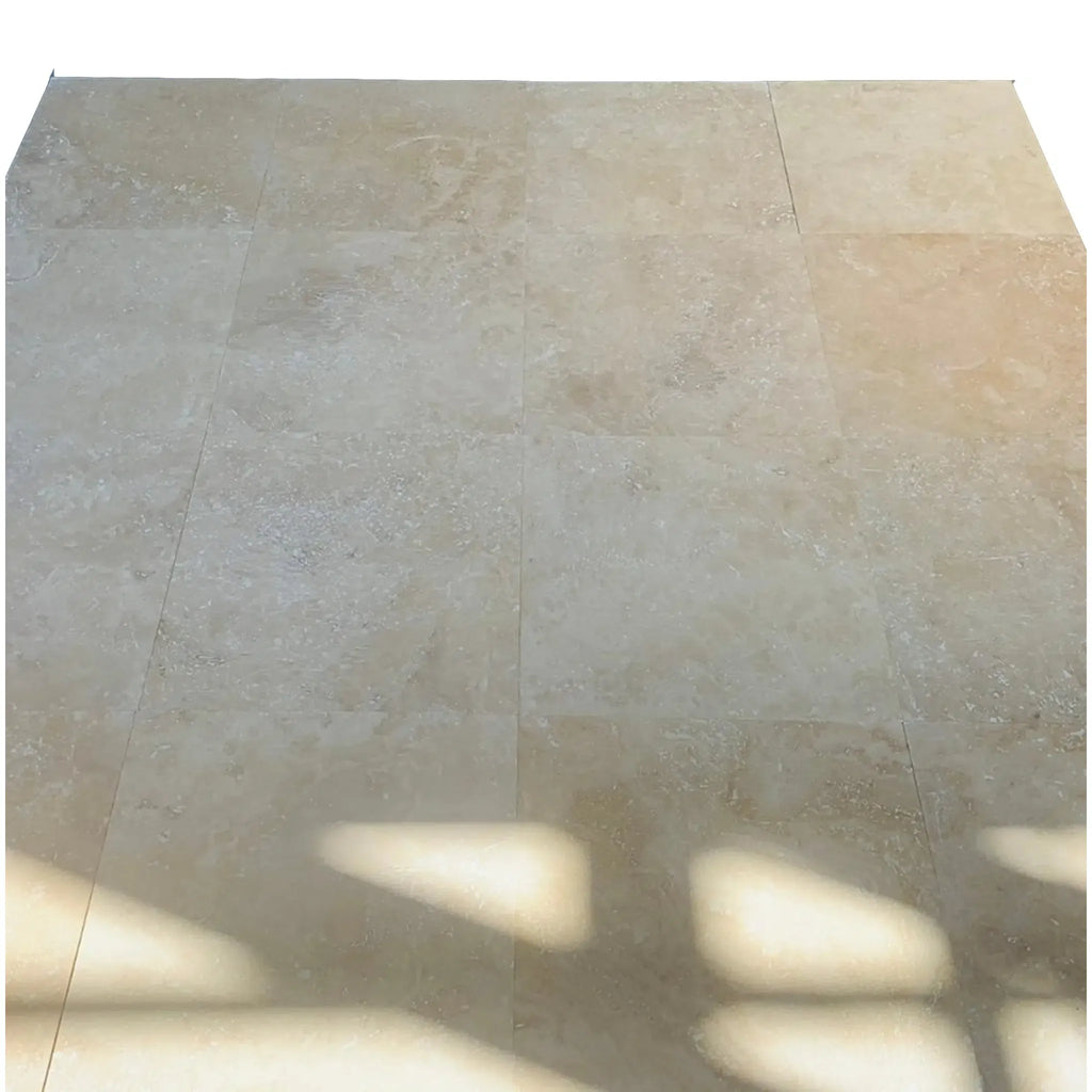 Beige tiled floor featuring Ivory Travertine Octagon with Noce dots mosaic design